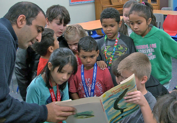 kids reading a story with a mentor